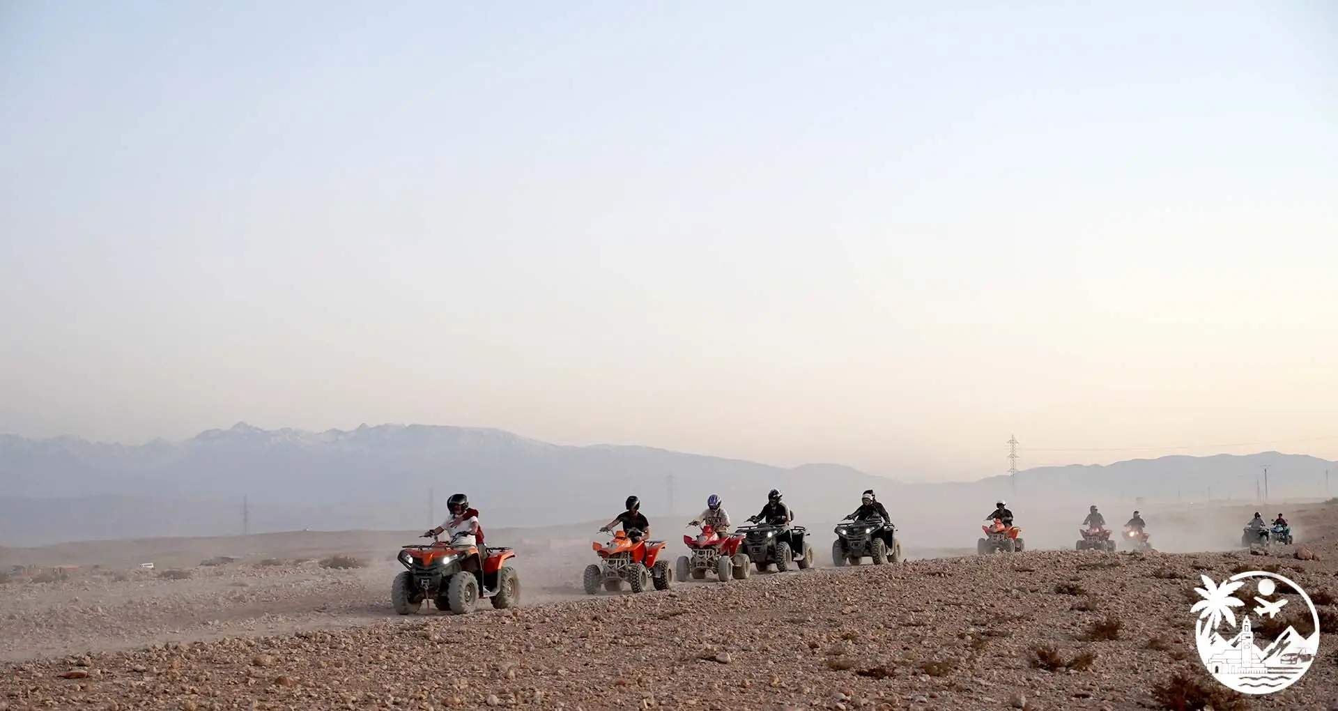 People riding quad bikes in the Agafay Desert, Morocco