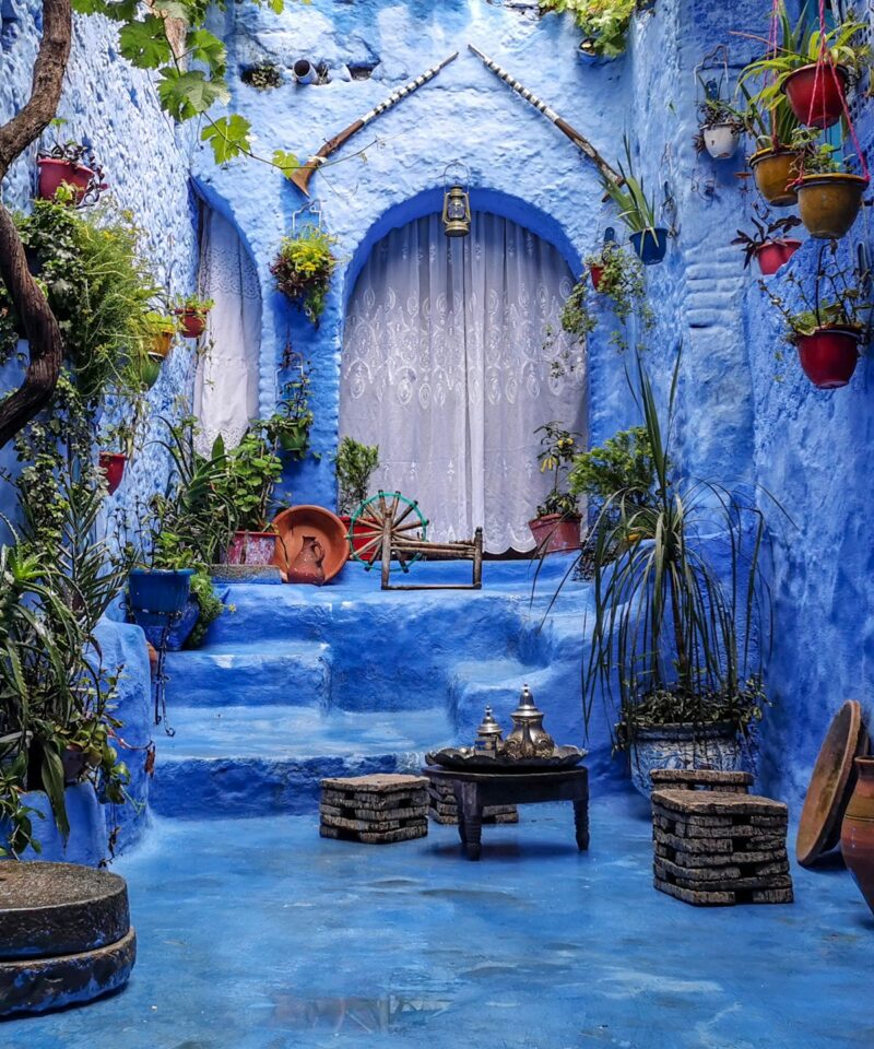 Scenic view of the cities of Tangier and Chefchaouen with traditional Moroccan architecture and blue skies.